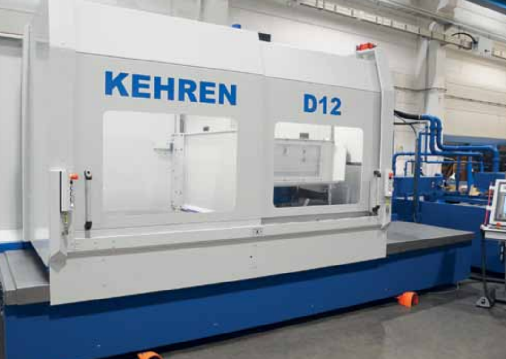 Surface grinder with dual rotary table and vertical grinding shaft